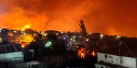 epa09399808 Smoke and flames rise as a wildfire burns the area of Skepasti in Evia island, eastern coast of Central Greece, 05 August 2021 (issued 06 August 2021).The battle with the flames continued for a third consecutive day in north Evia, where various fronts had joined to form three massive fire fronts moving in different directions and moving toward the sea.The region of Central Greece announced that the villages Aghia Anna, Kerasia and Ahladi in northern Evia must be evacuated due to the raging fire in the area.  EPA-EFE/PANAGIOTIS KOUROS