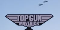 epa09927607 A group of F/A-18 jets fly overhead the global premiere of 'Top Gun: Maverick' on the USS Midway in San Diego, California, USA, 04 May 2022. The movie is set to release in US theaters 27 May 2022.  EPA-EFE/CAROLINE BREHMAN
