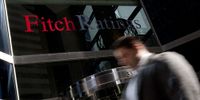 Pedestrians walk past the financial agency Fitch Ratings Ltd. (Photo: Scott Eells/Bloomberg via Getty Images)