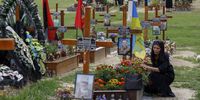 epa10095954 Relatives and friends of fallen soldiers who died defending the territorial integrity of Ukraine attend the commemoration of fallen Heroes of Ukraine on the Day of Ukrainian Statehood on the Marsovo Pole military cemetery in the Western Ukrainian city of Lviv, Ukraine, 28 July 2022. Ukraine marked the Day of Ukrainian Statehood for the first time on 28 July 2022. Ukrainian President Zelensky approved the new public holiday one year earlier, and parliament adopted it in May 2022. Russian troops on 24 February entered Ukrainian territory, starting a conflict that has provoked destruction and a humanitarian crisis.  EPA-EFE/MYKOLA TYS