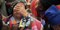 Grandmother of the children Nozixele Mntsizela is overcome during the funeral of her three grandchildren and daughter at Jabavu village, near Lusikisiki, Eastern Cape, on 20 September 2023. (Photo: Hoseya Jubase)