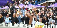 DURBAN, SOUTH AFRICA - JULY 02: Punters celebrate during the Hollywoodbets Durban July 2022 at Hollywoodbets Greyville Racecourse on July 02, 2022 in Durban, South Africa. (Photo by Darren Stewart/Gallo Images)