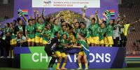 Banyana Banyana celebrate after winning the 2022 Women’s Africa Cup of Nations<br>final against Morocco in Rabat on 23 July. (Photo: Ryan Wilkisky / BackpagePix)