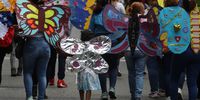 epa10328291 Women, with wings and butterfly painting alluding to freedom, participate in a march to raise their voices against violence against women as part of the celebration of '25N', International Day for the Elimination of Violence against Women, in Caracas, Venezuela, 25 November 2022.  EPA-EFE/Miguel Gutierrez