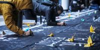 epa08093782 Protesters write on a banner during a rally at Edinburgh Place in the Central District in Hong Kong, China, 29 December 2019. Thousands of protesters turned out in a cold and wet day in Hong Kong, which has entered its seventh month of mass protests, originally triggered by a now withdrawn extradition bill, and have since turned into a wider pro-democ PRAKASH racy movement.  EPA-EFE/VIVEK