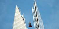 An 11ft sculpture of Superman is seen suspended at the top of The Shard on July 1, 2025 in London, England. (Photo by Ming Yeung/Getty Images)