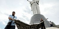 Museum workers carry a part of the Soviet Union coat of arms removed from the Motherland Monument in Kyiv, Ukraine, 30 July 2023. The Ukrainian coat of arms will replace the old Soviet one on the Motherland Monument by Independence Day, which Ukraine will mark on 24 August. Russian troops entered Ukraine on 24 February 2022 starting a conflict that has provoked destruction and a humanitarian crisis.  EPA-EFE/OLEG PETRASYUK