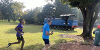 Toot toot no more: runners passing an old steam engine. Image: Mark Heywood