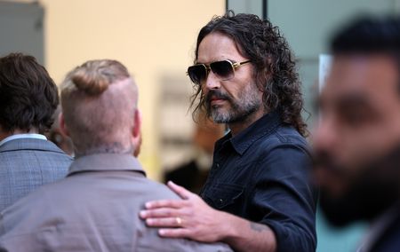 Comedian Russell Brand arrives at UK court to face rape and sex assault charges
