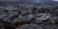 The still-hot, solid lava field lies under Fargradalsfjall volcano on August 19, 2021 near Grindavik, Iceland. The volcano, which erupted in March of this year and is located only a short drive from Iceland's main international airport, has become a major tourist attraction. Image: Sean Gallup / Getty Images