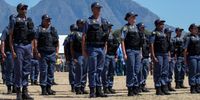 South African Police members of the new Anti Gang Unit (AGU) on parade during the launch of the new unit in Hanover Park, Cape Town. (Photo: EPA-EFE/Nic Bothma)