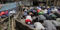 epa10326703 People perform Friday Prayers near a makeshift shelter at a village affected by the 5.6 magnitude earthquake in Cianjur, Indonesia, 25 November 2022. According to the National Disaster Management Authority (BNPB), at least 272 people killed after 5.6 magnitude earthquake hit southwest of Cianjur, West Java on 21 November 2022.  EPA-EFE/MAST IRHAM