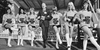 British MP Peter Walker (1932 - 2010), Baron Walker of Worcester, links arms with a group of dancers during the 'Keep Britain Tidy' campaign, London, UK, 5th July 1971.  (Photo by P. Shirley/Daily Express/Getty Images)