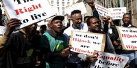 Foreign nationals protesting outside the Johannesburg Magistrates' Court calling for the release of others migrants who were arrested during the police raids after failing to produce documents as a proof of permission to be in the country.( Photo: SANDILE NDLOVU/Gallo Images)