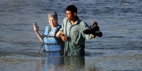 Migrants cross the Rio Grande in Eagle Pass Texas, USA, 22 September 2023. The Mayor of Eagle Pass Rolando Salinas Jr. estimated that 2,000 migrants crossed the border on 21 September, after about 3,000 migrants crossed into Eagle Pass on 20 September, according to the U.S. Representative Tony Gonzales. Mayor Salinas Jr. on 19 September declared a 'local state of disaster' in an emergency declaration issued after over 1,000 migrants crossed the border.  EPA-EFE/ADAM DAVIS