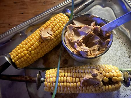 Braaied mielies smothered in Marmite butter