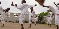 JUBA, SOUTH SUDAN - JULY 08: Young taekwando players from the Mercy School Taekwando Club are training on July 8, 2021 in Juba, South Sudan. South Sudan celebrated independence from Sudan on July 9, 2011 after years of conflict. Since independence, the country has remained unstable with an economic crisis, high inflation and political tensions with armed ethnic conflict. Ahead of South Sudan's anniversary, a report from UNICEF estimates that 8.3 million people require humanitarian support, with malnutrion, infant mortality and children's rights at the top of the list. (Photo by Andreea Campeanu/Getty Images)