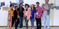 Members of the Karoo Karte project with curator and facilitator Vaughn Sadie <br>pose in front of a mural they created using images from the CP Nel Museum archive.<br>(Photo: Ashraf Hendricks)