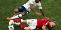  Christian Eriksen of Denmark (bottom) and Thomas Lemar of France in action during the FIFA World Cup 2018 group C preliminary round soccer match between Denmark and France in Moscow, Russia, 26 June 2018. EPA-EFE/YURI KOCHETKOV   