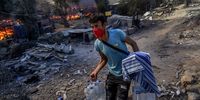 People flee a fire at Europe's largest camp for refugees and migrants. Tyranny may be justified by the championing of urgency to restrain the flow of immigrants, says economist Amartya Sen. Photo by Jacob Ehrbahn