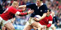 Doddie Weir (centre) of Scotland, hands off Neil Jenkins of Wales during a Five Nations Championship match at Murrayfield Stadium, Edinburgh, Scotland, 4th March 1995. Scotland won the match 26-13. (Photo: David Rogers / Getty Images)