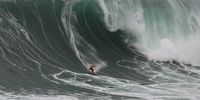 Brazilian surfer Maya Gabeira rides a wave during the WSL Tudor Nazare Big Wave Challenge at Praia do Norte in Nazare, Portugal, 22 January 2024.  EPA-EFE/CARLOS BARROSO