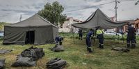 EMS personnel construct tents to house those who were left homeless.<br>Photo / Shiraaz Mohamed