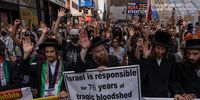  Pro-Palestine supporters raise their hands in the air during a protest on July 18, 2024 in New York City. Israeli airstrikes struck refugee camps in central Gaza Strip and Gaza City in the north today, killings at least 21 people, according to published reports. (Photo by Adam Gray/Getty Images)