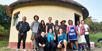 All the hikers at the last homestay in the village of Noqhekwana. From the left Jessie Hood, Alex Jennings, Patil Khakhamian, Tanya Shoeman, Jamila Janna, Masha Ramsamooch, and Lara hood. Jez jennings and his mother Bonny and Shona Aylward in front. Hosts Ncumisa Somakepu (Back, third from the right) and her sister Julia Jikumlambo. Photo: Sinegugu Zikhulu