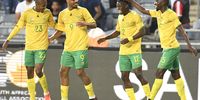 Lyle Foster of South Africa  celebrates with teammates during the 2023 Africa Cup of Nations qualifier match between South Africa and Liberia at Orlando Stadium on March 24, 2023 in Johannesburg, South Africa. (Photo by Lefty Shivambu/Gallo Images)