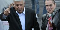 Andres Manuel Lopez Obrador (L) greets supporters accompanied by his wife Beatriz Gutierrez Mueller (R) after voting in the presidential and legislative elections, at an electoral college, in Mexico City, Mexico, 01 July 2018. The 89 million Mexicans who are on the electoral roll will elect 3,400 public officials, including the president of the country, 128 senators, 500 deputies, eight governors and the head of government of Mexico City.  EPA-EFE/MARIO GUZMAN