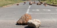 A road into Railton is blocked off with rocks. (Photo: Ashraf Hendricks)