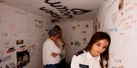 A medic reacts as she stands inside a bomb shelter near the site of the Nova festival, where partygoers were killed and kidnapped during the October 7 attack by Hamas gunmen from Gaza, on Israel's Memorial Day, when the country commemorates fallen soldiers of Israel's wars and Israeli victims of hostile attacks, in Reim, southern Israel May 13, 2024. REUTERS/Amir Cohen     TPX IMAGES OF THE DAY