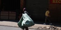 A homeless person gathers recyclables near the wanderers taxi rank in Johannesburg on 14 October 2025. (Photo: Felix Dlangamandla)
