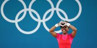PARIS, FRANCE - AUGUST 07: Rosina Randafiarison of Team Madagascar celebrates after performing a clean and jerk during the Weightlifting Women's 49kg on day twelve of the Olympic Games Paris 2024 at South Paris Arena on August 07, 2024 in Paris, France. (Photo by Lars Baron/Getty Images)