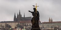 A statue on Charles Bridge points to Prague Castle, official seat of the Czech President, in Prague, Czech Republic, 26 January 2023. Former NATO Military Committee chairman Petr Pavel will face former Czech Prime Minister Andrej Babis in the second round of the country's presidential election, scheduled to take place on 27 and 28 January 2023.  EPA-EFE/MARTIN DIVISEK