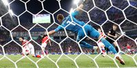 Andrej Kramaric (R) of Croatia scores the 1-1 against goalkeeper Igor Akinfeev of Russia during the FIFA World Cup 2018 quarter final soccer match between Russia and Croatia in Sochi, Russia, 07 July 2018. EPA-EFE/FRIEDEMANN VOGEL