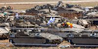 Israeli troops with a variety of military vehicles at a gathering site in an undisclosed location along the Israel-Gaza border on 17 October 2023. (Photo: EPA-EFE / Hannibal Hanschke) 