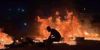 Libyan demonstrators burn tires to protest against the meeting of the Foreign Minister of the National Unity Government, Najla al-Mangoush, with her Israeli counterpart in Italy , in Tripoli, Libya on 27 August 2023. A statement released by the head of the Libyan government Abdelhamid Debaïbah, announced the suspension of the Libyan Minister of Foreign Affairs and the opening of an administrative investigation, which will be carried out by a commission chaired by the Minister of Justice.  EPA-EFE/STR