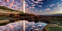 Slangkop Lighthouse in Kommetjie. The best place in Cape Town to see beautiful sunsets. Photographer: Emile Grundlingh