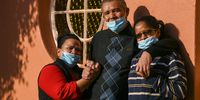Thiren Johnson, 61, with his wife Sylvia Johnson, left, and his daughter Lucinda Diedricks. Johnson is recovering from Covid-19 at home in Ennerdale after being discharged from the Nasrec Quarantine and Isolation Centre. He was moved to the Nasrec centre from the Helen Joseph Hospital after contracting Covid-19. (Photo: Chris Collingridge)