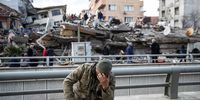 HATAY, TURKEY - FEBRUARY 07: A soldier sits devastated near the collapsed building on February 07, 2023 in Hatay, Turkey. A 7.8-magnitude earthquake hit near Gaziantep, Turkey, in the early hours of Monday, followed by another 7.5-magnitude tremor just after midday. The quakes caused widespread destruction in southern Turkey and northern Syria and were felt in nearby countries. (Photo by Burak Kara/Getty Images)