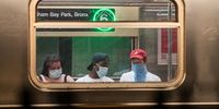 Passengers wearing protective masks ride the subway in New York, U.S., on Wednesday, June 10, 2020. New York streets got a little more congested this week as the city entered Phase 1 of its re-opening from the coronavirus-imposed lockdown. Photographer: Jeenah Moon/Bloomberg via Getty Images