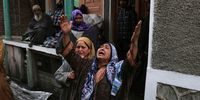A Kashmiri woman reacts in front of her damaged house following a fire in Srinagar, the summer capital of Indian Kashmir, 10 February 2025. The fire, which reported no casualties, left at least five residential houses destroyed, according to officials.  EPA-EFE/FAROOQ KHAN