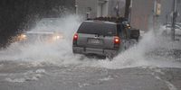 epa09421137 Cars maneuver the streets as heavy rains from the remnants of Tropical Storm Fred flood the streets in, Massachusetts, USA, 19 August 2021.  EPA-EFE/CJ GUNTHER