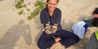 All smiles to be working with loggerhead hatchlings. (Photo: Andy Coetzee)