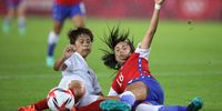 RIFU, MIYAGI, JAPAN - JULY 27: Mina Tanaka #11 of Team Japan and Saez Camila #18 of Team battle for the ball Chile during the Women's Group E match between Chile and Japan on day four of the Tokyo 2020 Olympic Games at Miyagi Stadium on July 27, 2021 in Rifu, Miyagi, Japan. (Photo by Koki Nagahama/Getty Images)