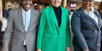 Prof Debra Roberts in an emerald green suit, with Sbu Ndeble, acting head of development planning in the Ethekwini municipaliy (left) and Chumisa Tengwa, outgoing deputy head of the city’s biodiversity management unit at a climate change meeting in Durban last year. (Photo: Supplied)