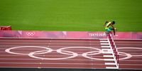 epa09385673 Jaheel Hyde (R) of Jamaica in action during the Men's 400m Hurdles Semi-Final during the Athletics events of the Tokyo 2020 Olympic Games at the Olympic Stadium in Tokyo, Japan, 01 August 2021.  EPA-EFE/FRANCK ROBICHON