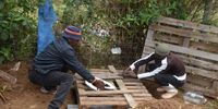 Sahkiwo Moeldoh builds a long drop toilet on the edge of a stream in Makhanda. (Photo: Deon Ferreira)